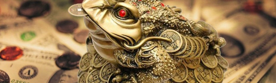 Un crapaud avec une monnaie dans la bouche un talisman pour attirer de l'argent